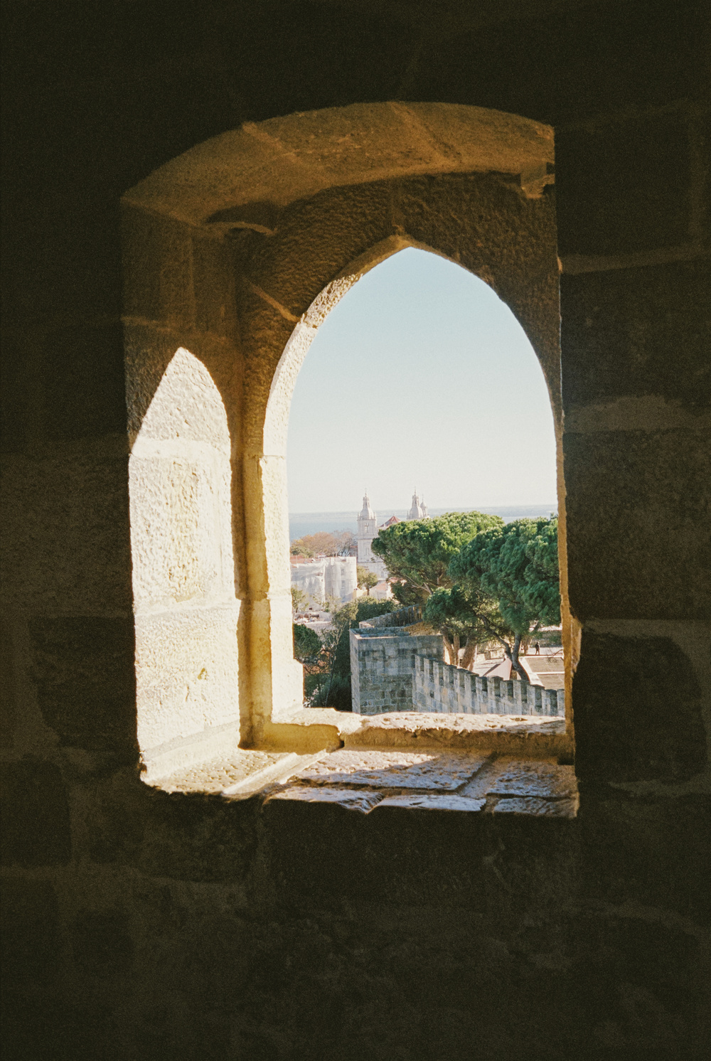 Stone arch window framing a view